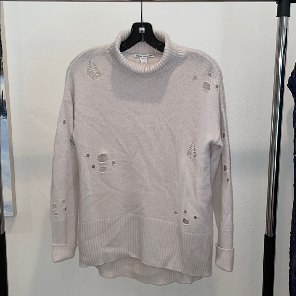 Cream sweater with fun holes and rips
